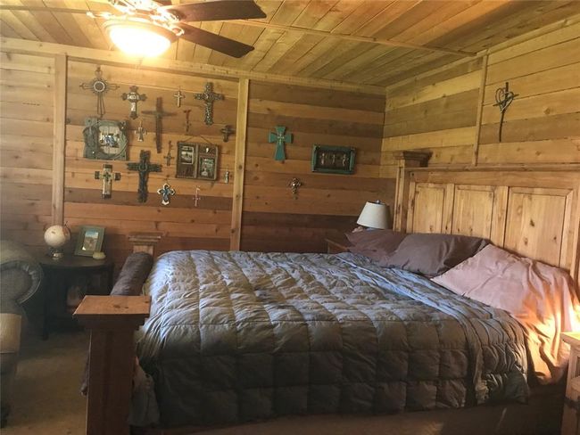 Large Bedroom, completed with cedar covering walls and ceilings. | Image 16