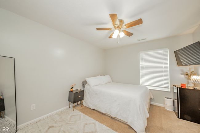 carpeted bedroom with baseboards and ceiling fan | Image 29
