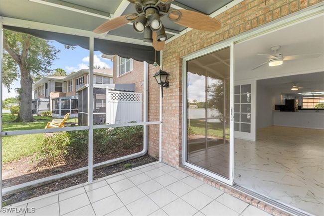 Unfurnished sunroom featuring ceiling fan and a wealth of natural light | Image 6