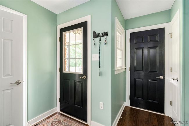 The side entrance and door to the garage | Image 22