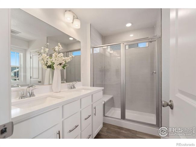 Primary Attached Bath with Dual Undermount Sinks and Walk-in Shower with Bench Seating | Image 16