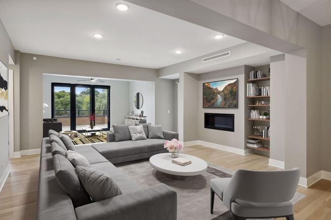 Gas fireplace and hardwood floors in the main living areas | Image 6