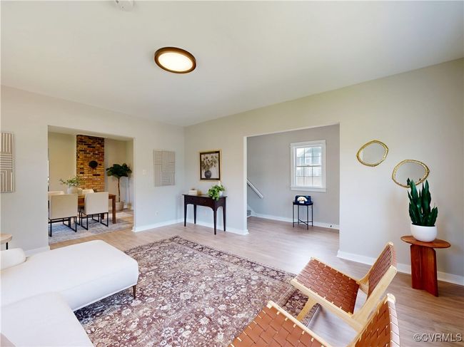 Living room and cased opening to foyer | Image 12
