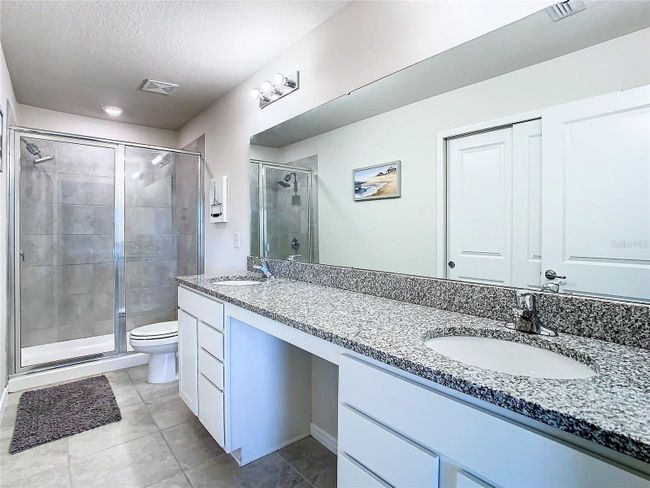 Primary bathroom with double sinks and granite counter top | Image 25