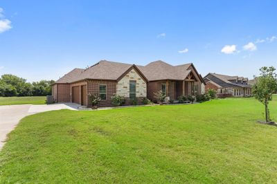 View of front of home featuring a garage and a front yard | Image 3