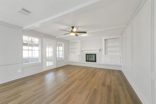 Living room with gas fireplace and built ins | Image 4