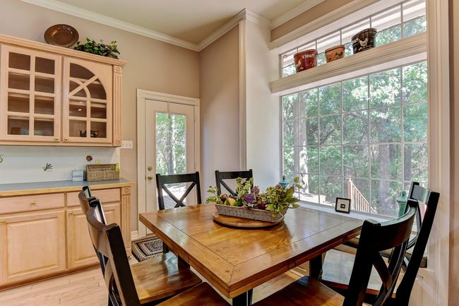 Dining space featuring light wood-type flooring and ornamental molding | Image 14