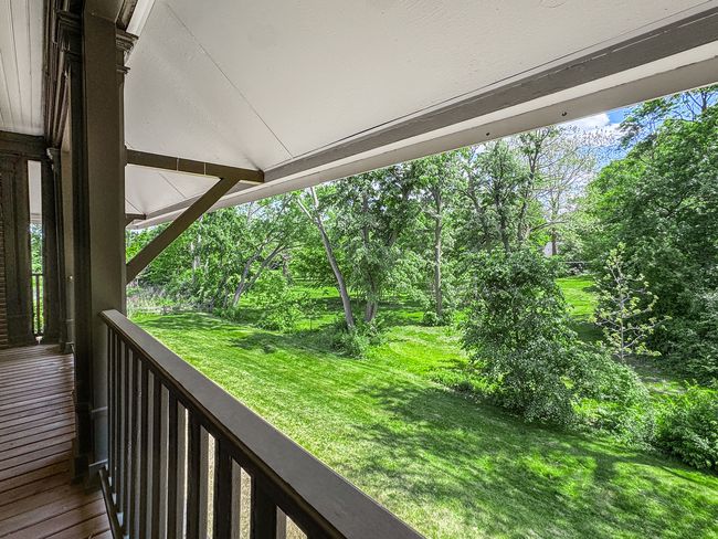 The deck offers panoramic views of the backyard an | Image 19