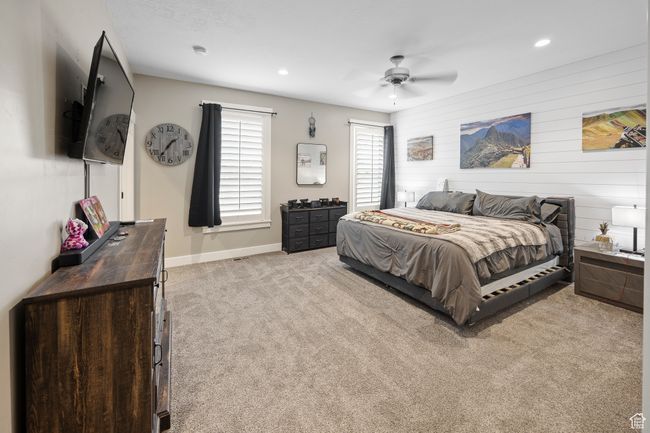 Carpeted bedroom featuring baseboards, ceiling fan, and recessed lighting | Image 41