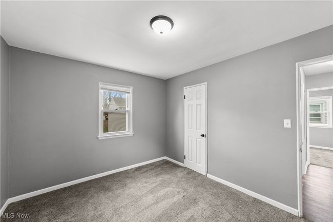 Bedroom featuring carpet floors and baseboards | Image 19