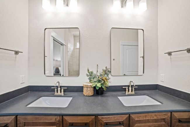 Full bathroom featuring double vanity and a sink | Image 24