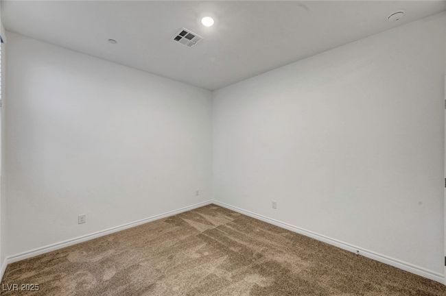 Carpeted empty room featuring baseboards, visible vents, and recessed lighting | Image 41