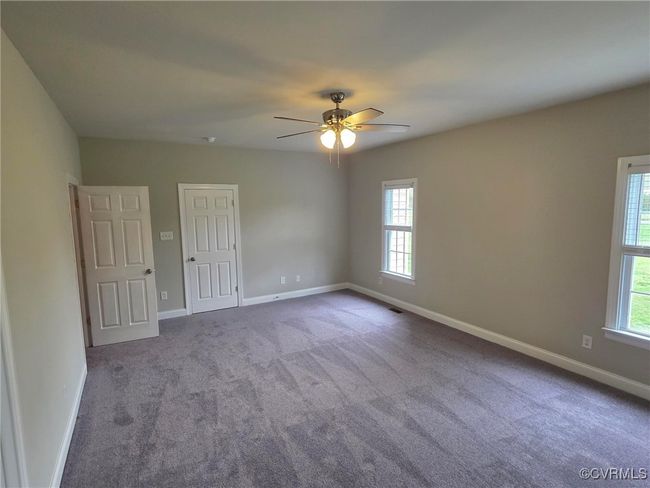 Foyer featuring crown molding, baseboards, ceiling fan, and wood finished floors | Image 14