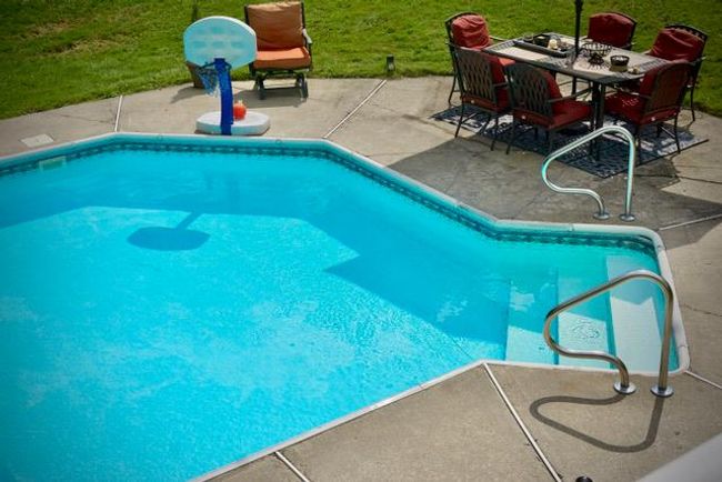 View of pool featuring a lawn and a patio area | Image 28