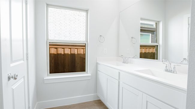Bathroom with hardwood / wood-style floors, vanity, and a wealth of natural light | Image 5