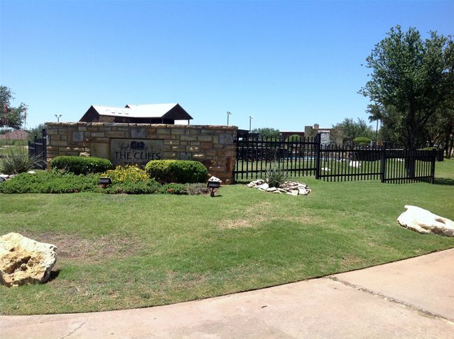 Curbside view of the main pool with waterfall. | Image 15