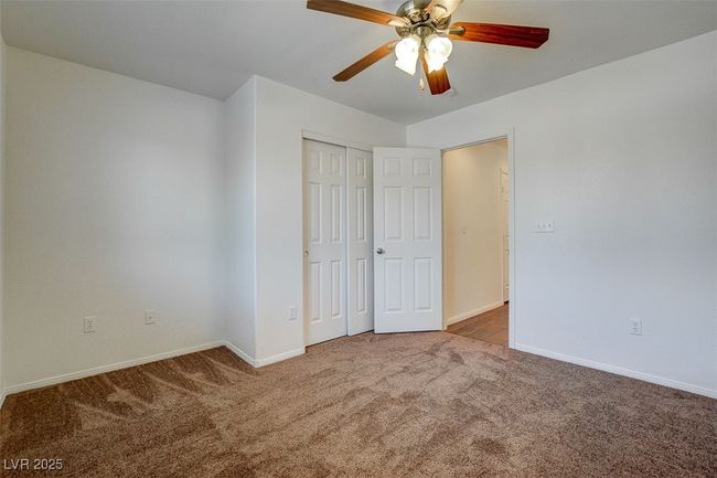Unfurnished bedroom featuring ceiling fan, a closet, baseboards, and carpet floors | Image 19