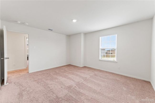 Unfurnished room featuring light colored carpet and baseboards | Image 19