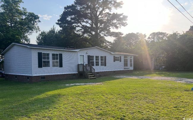 Manufactured / mobile home with crawl space and a front lawn | Image 7