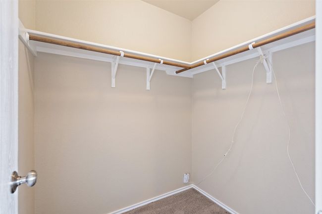 Walk in closet with carpet flooring | Image 30