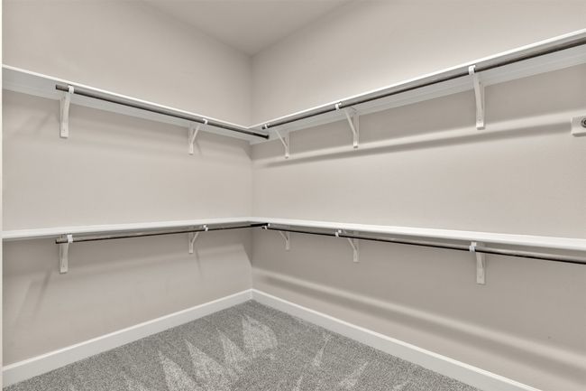 Spacious closet with carpet floors | Image 23