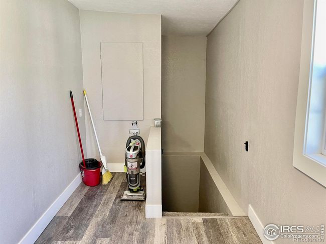 landing area that leads to basement | Image 22