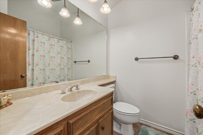 Full bathroom with vanity and a shower with curtain | Image 25
