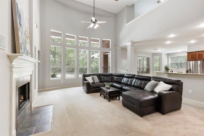 A wall of windows frames the family room and continues to the breakfast room that sits adjacent . | Image 10