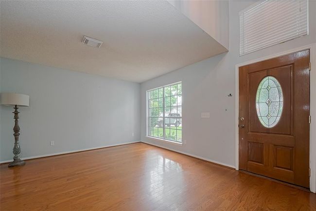 The front door entry opens to the Living Room | Image 7