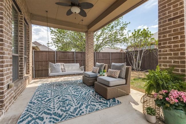 Relax on the extended covered porch. The swing stays with the property at closing! | Image 30