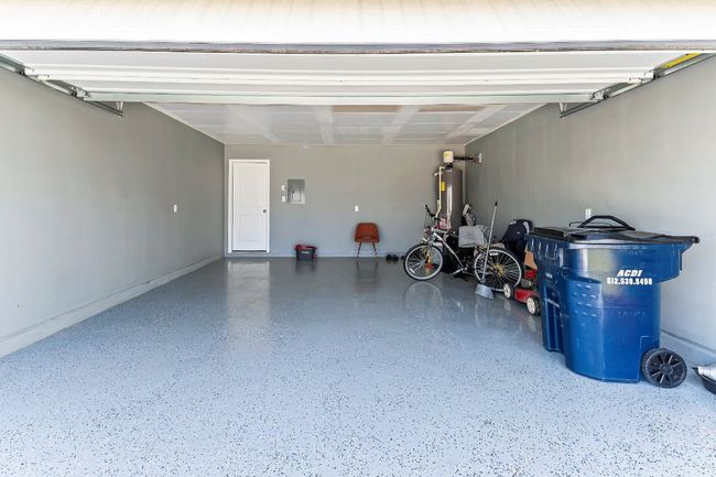 Garage featuring electric panel and water heater | Image 31
