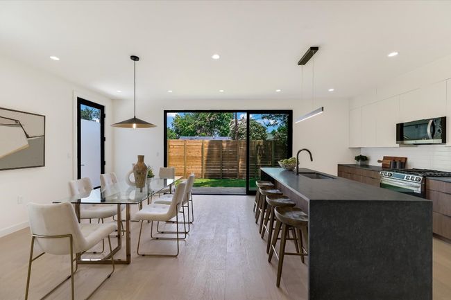 Dining room with light wood-type flooring and recessed lighting | Image 14