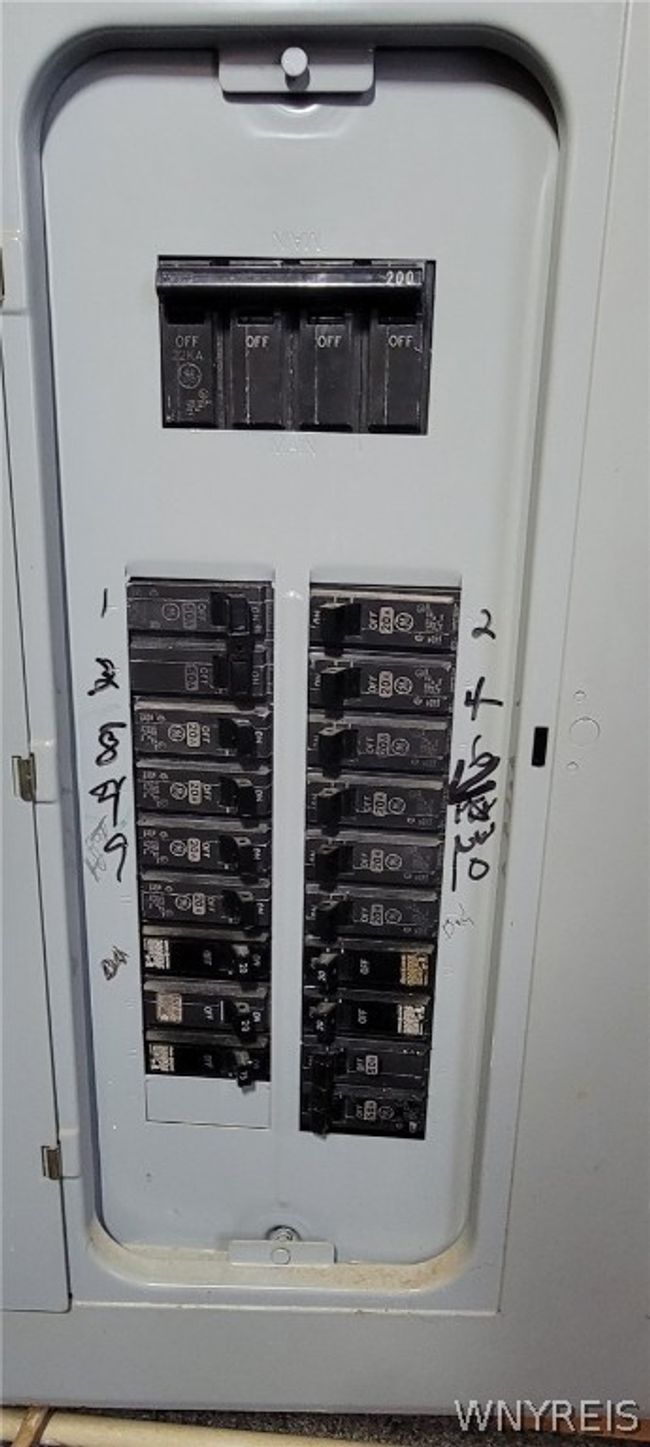 200 amp electrical panel (in bedroom 1 behind doors) | Image 18