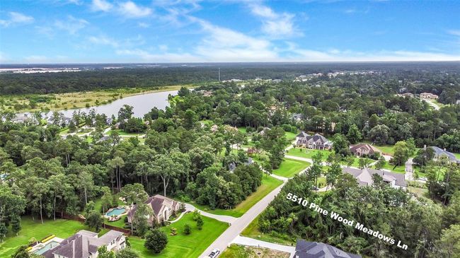 Build your dream home on this stunning wooded lot, where possibilities abound—whether you envision a timeless traditional design or a sleek modern retreat. Located in the prestigious Bender’s Landing Estates, this property offers more than just beautiful surroundings. | Image 5