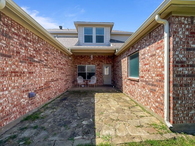 Batck patio partially coverd & flag stone pavers | Image 20