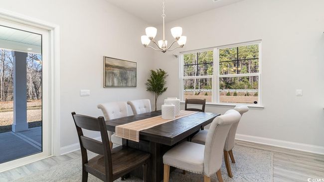 Kitchen with appliances with stainless steel finishes, backsplash, sink, and a kitchen island with sink | Image 19