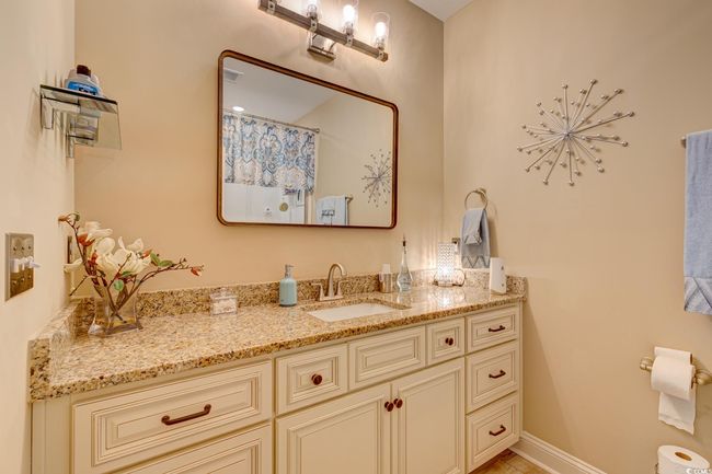 Bedroom with light carpet, a ceiling fan, visible vents, and baseboards | Image 20