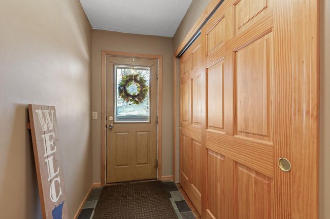 Entry with large closet for storage | Image 7