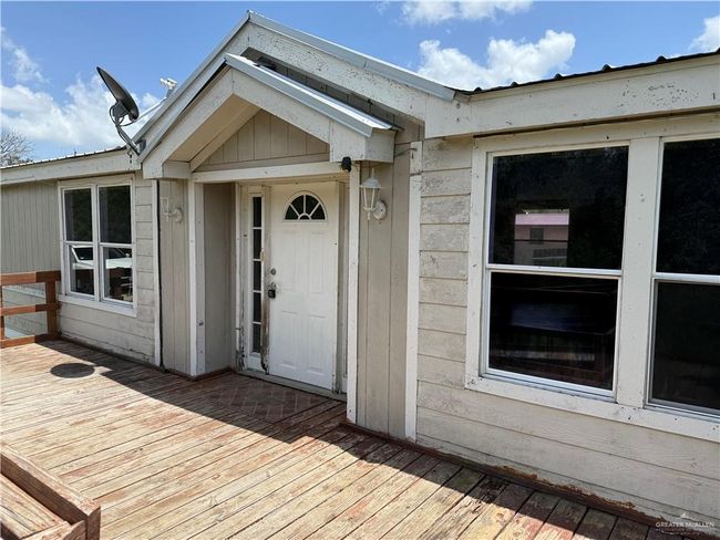 View of exterior entry with a deck | Image 8