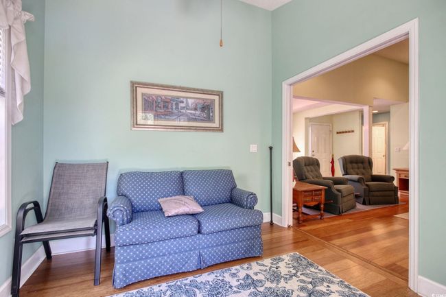 Sitting room featuring wood finished floors and baseboards | Image 21