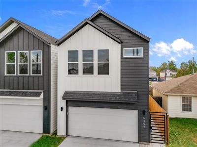 Modern black and white facade. The large driveways offer ample parking, ensuring convenience for you and your guests. | Image 3