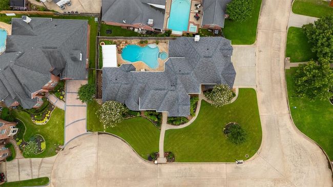From above, the thoughtful design of this home truly shines. The layout is expansive yet balanced, offering a harmonious blend of grandeur and functionality — a testament to the care and planning poured into every square foot. | Image 6