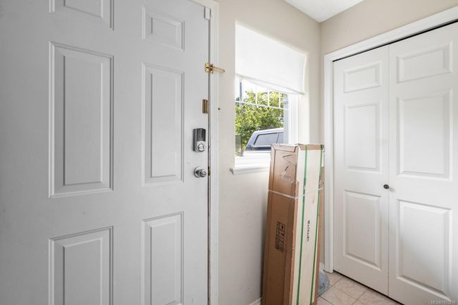 FRONT DOOR ENTRY TO ABOVE GROUND LOWER LEVEL WINDOWED/CLOTHS CLOSET/STAIRS TO UPPER MAIN LEVEL | Image 17