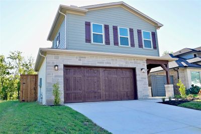 View of front facade featuring a garage and a front lawn | Image 2