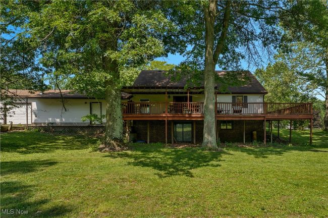 Back of property featuring a wooden deck and a lawn | Image 42