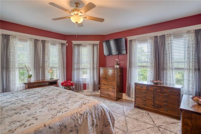 Bedroom with ceiling fan | Image 16