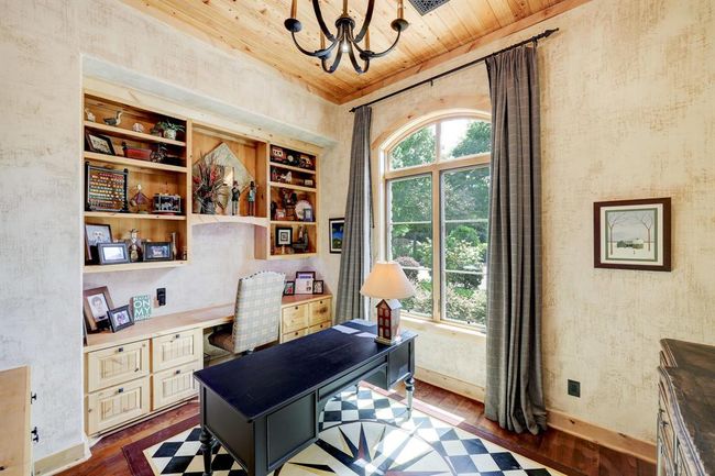 The second study or library includes built in shelving and beautiful natural lighting. | Image 11