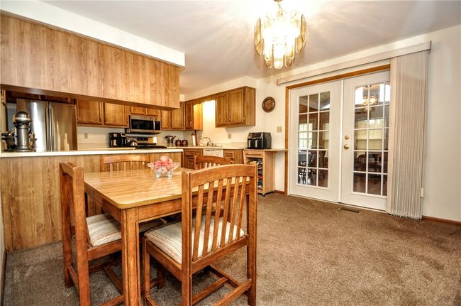 Your dining room area looking into the kitchen and sunroom! | Image 22