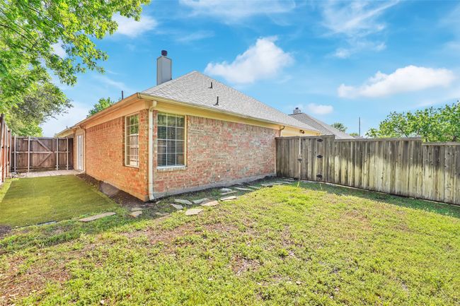 Rear view of house with a lawn | Image 24