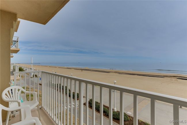 Balcony featuring a view of the beach and a water view | Image 10